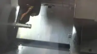 Shop made CNC bar feeder /puller in action