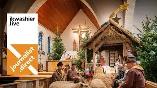 Kerstviering met levende kerststal - Kerstmis met schapen en baby in Sint-Godelievekerk Moerbrugge