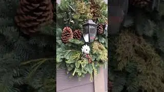 The wreath at our house...rick, archer and a &ldquo;face sucker&rdquo; all make an appearance
