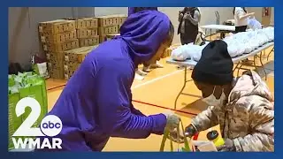 Fresh off win, Ravens players help give away Thanksgiving food
