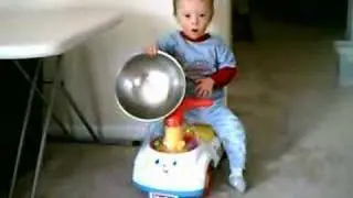 Lucas in corn popper with bowl 2-18-2007