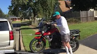 Loading a motorcycle onto a hitch carrier with a power winch