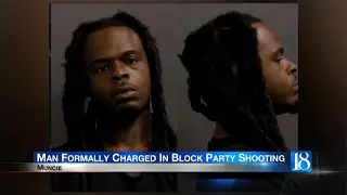 Man formally charged in block party shooting