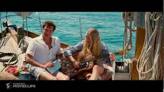 Lucy singing and playing guitar