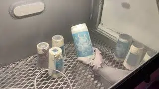 Sandblasting a can glass with original Octopus Cat art by Bread and Badger