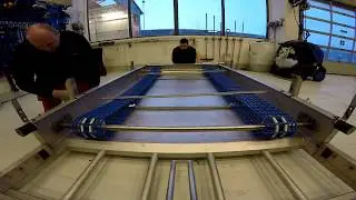 Adjusting scraper belt on the MudCube