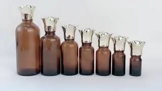 China High Quality Amber 50Ml 100Ml Big Volume Glass Essential Oil Bottle with Gold Cover
