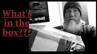 unboxing a mystery box from David's Book Reviews.