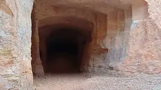 Coober pedy opal claim . Open cut with extensive multi level tunnels.