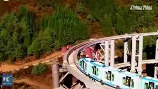 High-speed train climbing stairs? Rare spiral monorail bridge becomes popular