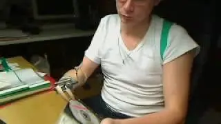 Picking up CD using Otto Bock hook prosthesis