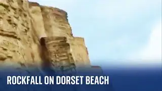 Dorset: Rockfall on a beach narrowly misses people walking below
