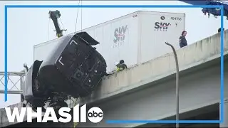 Man rescued after semi cab dangles off bridge in Louisville