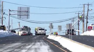 Snapped utility poles force closure of Route 9