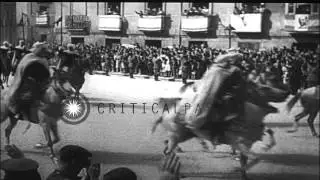 Damaged buildings of war and Francisco Franco wave to people at the end of war in...HD Stock Footage