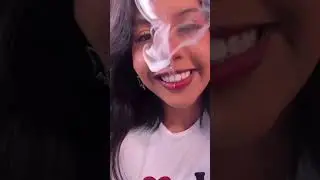 BEAUTIFUL LATIN GIRL WITH PIERCING SMOKING CIGARETTES