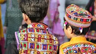Indian festival celebration showing children wearing vibrant traditional embroidered clothing