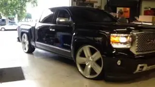Lowered GMC Denali on 26s