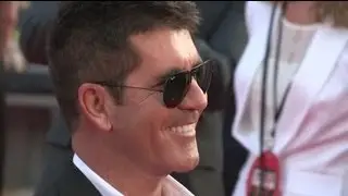 Simon Cowell Reveals He's 'Proud' To Be a Dad at One Direction Film Premiere - Splash News