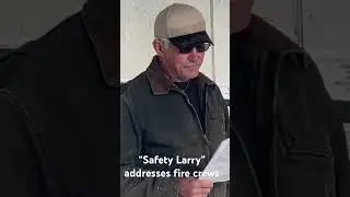 Safety Larry Welsh speaks to fire crews in Alaska following morning operational fire briefing