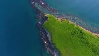 Green island in blue sea