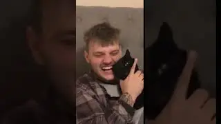 Jay Swingler tries to eat his cats ear