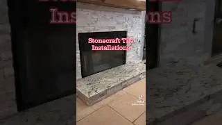 Stackstone fireplace with custom lighting installed in mantle