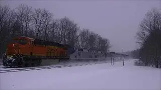 BNSF freight unit leads Amtrak in a snow storm