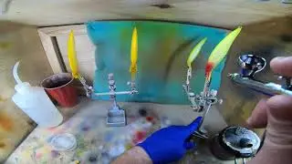 Airbrushing two variations of a Clown pattern on a jerkbait
