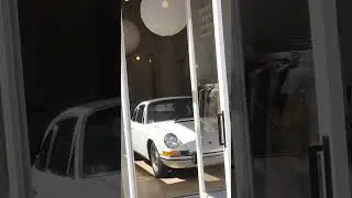Buck Mason features an old fashioned white car in store Fashion Island mall | California (4/21/2023)