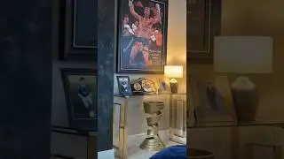 josh taylor's shows his muhammad ali trophy and undisputed belt collection
