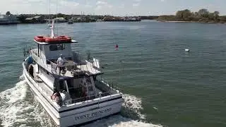 Point Princess fishing charter entering Manasquan Inlet, Point Pleasant Beach, New Jersey.