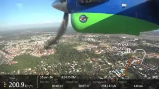 Scenic aerial view of Miri, Sarawak, Malaysia:  MasWings Twin Otter landing