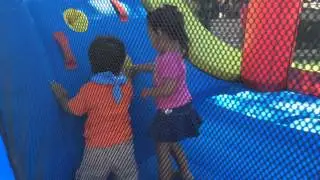 Declan jumping in the bouncy house