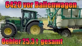 John Deere 6420 mit Oehler DDK 240 BK (10 m) - System Krassort mit Siloballen beladen.