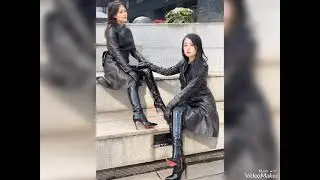 Gorgeous Asian womens styling in magnificent knee high boots & impressive outfit