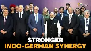 Group photo of PM Modi and the German Chancellor during the India&ndash;Germany CEOs Forum in Ahmedabad