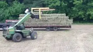 John Deere 4400 Telehandler uses grapple to stack hay