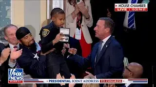 Secret Service Director Sean Curran gives DJ Daniel a hug