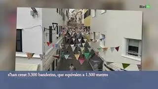 El carrer Nou de Ma&oacute; s'engalana amb una enramada solid&agrave;ria i sostenible