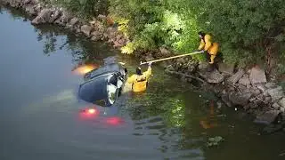Fond du Lac Fire Fighter gets into submerged car in Fond du Lac River to check for occupants
