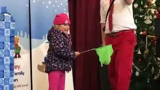 Amelia assists Joel Tracey in Let it Snow Magic Show. Ashley, Mi 2023