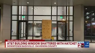 AT&T building window shattered with hatchet