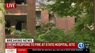 Firefighters work to put out fire at former Norwich State Hospital