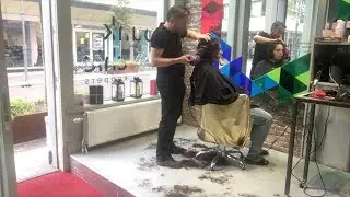A curly bob haircut with undercut