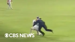 A Dodgers fan's surprise proposal goes viral after he was tackled in the outfield