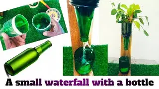 A small waterfall with a bottle