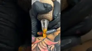 Yellow colour tattoo fling🤯🤯 #tattoo #portrait #shorts video