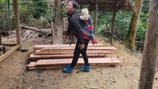 mother and baby continued carrying planks to build walls for their house, Cook porridge to eat
