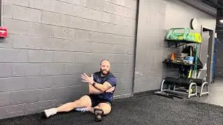 Coaching the Feet on Wall Deadbug Pullover 